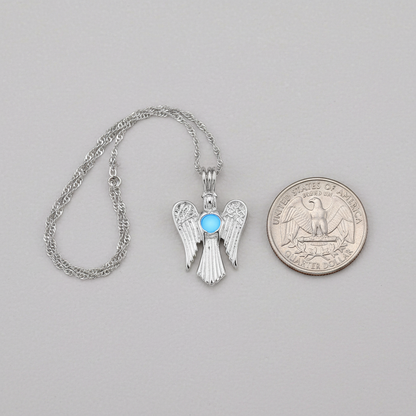Luminous Angel Wing Pendant compared with a U.S. quarter