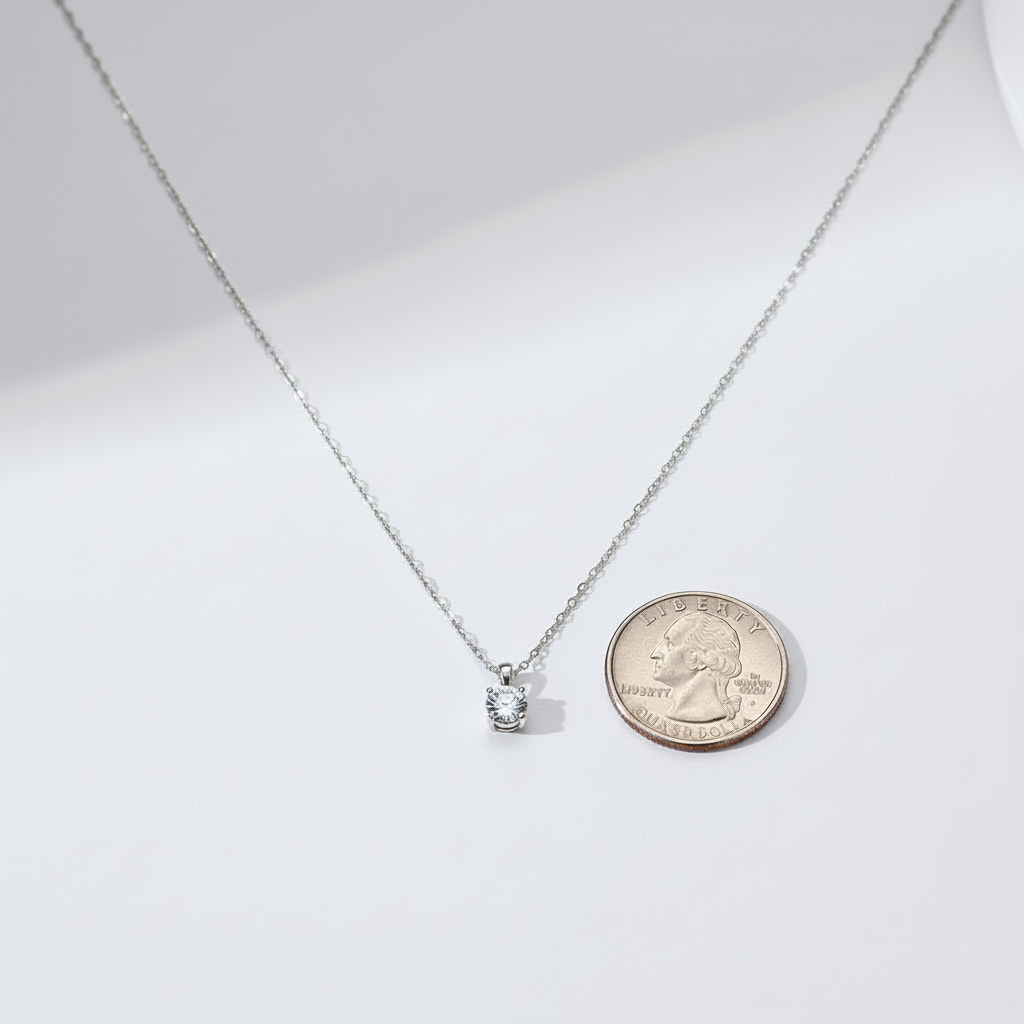 Necklace and quarter comparison on a brighter white background